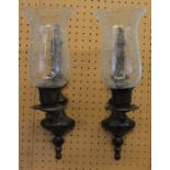 Pair of modern bronze wall sconces with crackle glass shades (one cracked)