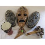 Selection of tribal masks H 49 cm and 41 cm together with various tribal style instruments