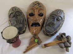 Selection of tribal masks H 49 cm and 41 cm together with various tribal style instruments