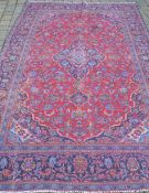 Traditional red ground Persian Kashan carpet 290cm by 192cm
