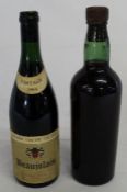 Vintage bottle with no label or stamp containing possibly red wine or port & bottle of Andre