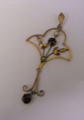 Tested as 9ct gold garnet and seed pearl pendant H 5 cm weight 1.9 g