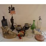 Cheese dishes, soda siphon, jelly moulds, figure of a nude, lamp etc