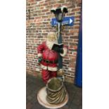 Life size Santa Claus standing under a lamppost light (light fitting loose), 200cm tall