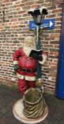 Life size Santa Claus standing under a lamppost light (light fitting loose), 200cm tall