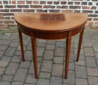 Early 20th century demi-lune Georgian style mahogany fold over tea table on tapering legs