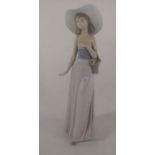 Large Nao figurine of a woman with a basket H 32 cm