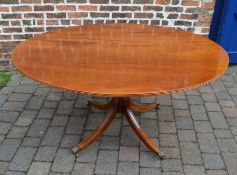 Archer & Smith reproduction Georgian circular tilt top loo table with sabre legs supporting a