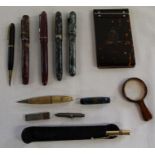 Selection of fountain pens including Stephens & Burnham B59, notepad, magnifying glass etc.