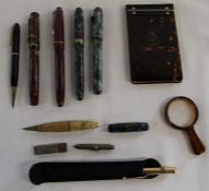 Selection of fountain pens including Stephens & Burnham B59, notepad, magnifying glass etc.