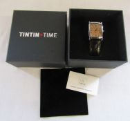 Boxed gents Tintin watch with brown leather strap