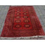 Persian red ground carpet 224cm by 137cm