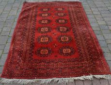 Persian red ground carpet 224cm by 137cm