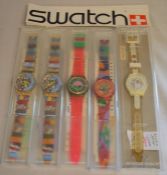 5 ex-shop stock Swatch wristwatches with advertising stickers