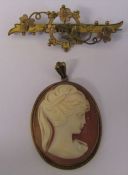 9ct gold forget me not brooch L 5 cm weight 2.3 g and a 9ct gold cameo pendant 3.5 cm x 2.5 cm total