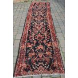 Large deep ground Persian Sarouk runner rug hand woven with a floral pattern