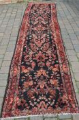 Large deep ground Persian Sarouk runner rug hand woven with a floral pattern