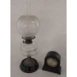 Paraffin lamp H 59 cm and a Franklin & Hare Ltd mantel clock H 18 cm