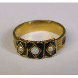Tested as possibly 15ct gold Victorian mourning ring, decorated with black enamel, seed pearls,