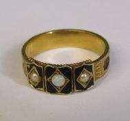 Tested as possibly 15ct gold Victorian mourning ring, decorated with black enamel, seed pearls,