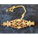 Tested as 15ct gold brooch inset with rubies & spinels 5.3g
