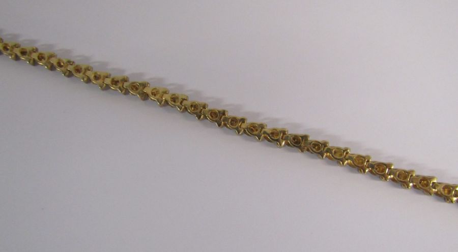 9ct gold diamond tennis bracelet with illusion set stones - length 19.4cm - weight 6.6g - Image 9 of 14