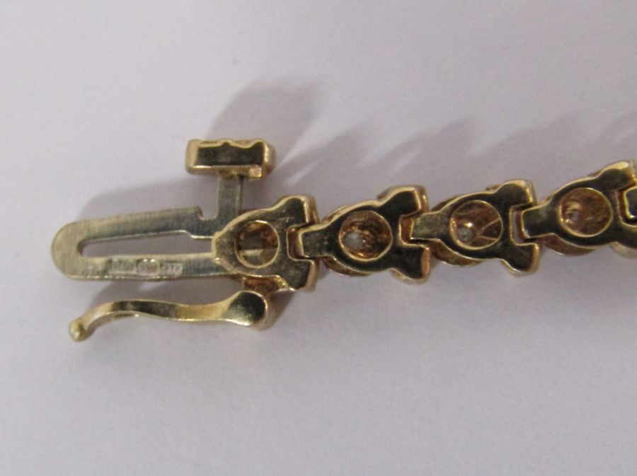 9ct gold diamond tennis bracelet with illusion set stones - length 19.4cm - weight 6.6g - Image 13 of 14