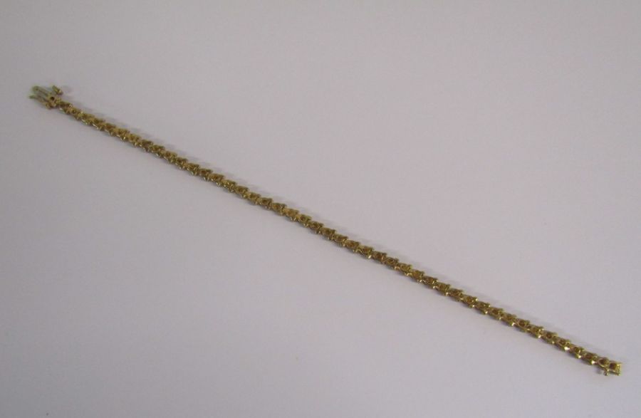 9ct gold diamond tennis bracelet with illusion set stones - length 19.4cm - weight 6.6g - Image 7 of 14
