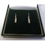 Pair of 9ct white gold Art Deco style triple diamond earrings weight 1.1 g