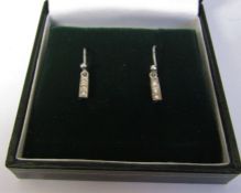 Pair of 9ct white gold Art Deco style triple diamond earrings weight 1.1 g