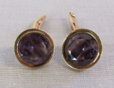 Pair of Amethyst & gold cufflinks marked 14k - Stone 1.2cm - total weight 7.6g