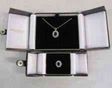 9ct gold sapphire and 12 cubic zirconia stone cluster ring with matching pendant and 9ct gold