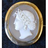 Cameo brooch of a classical lady in profile on a yellow metal mount 5cm by 4.3cm