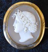 Cameo brooch of a classical lady in profile on a yellow metal mount 5cm by 4.3cm