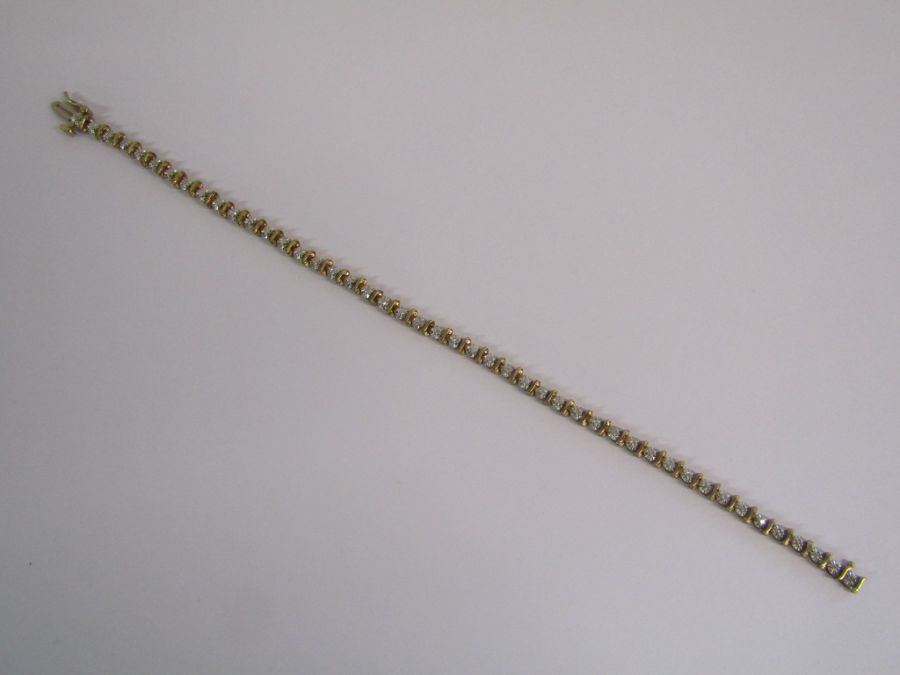 9ct gold diamond tennis bracelet with illusion set stones - length 19.4cm - weight 6.6g - Image 2 of 14