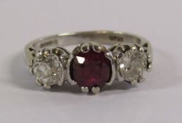 18ct white gold, ruby and diamond ring - a brilliant cut ruby size 0.70 with 2 brilliant cut