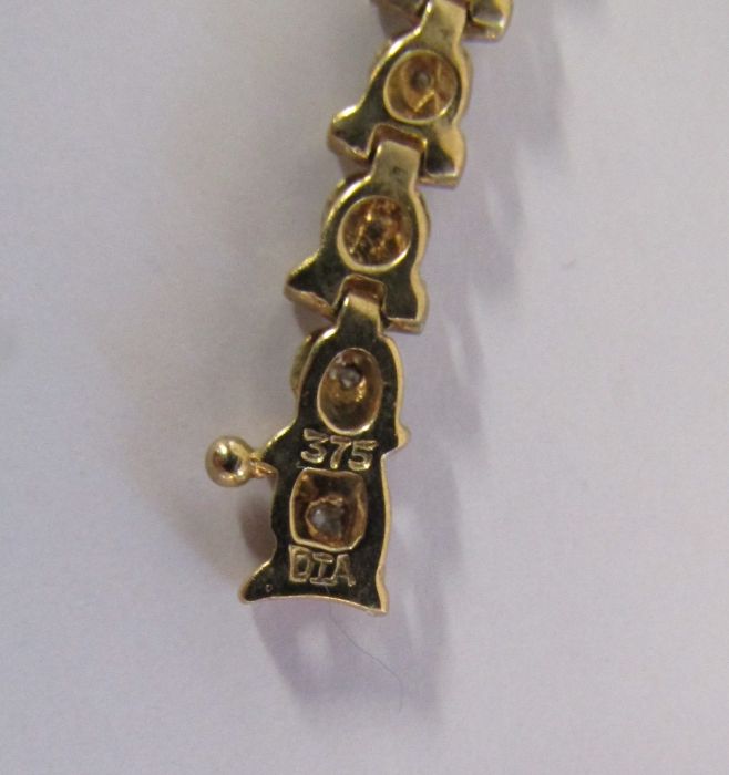 9ct gold diamond tennis bracelet with illusion set stones - length 19.4cm - weight 6.6g - Image 12 of 14