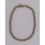 9ct gold diamond tennis bracelet with illusion set stones - length 19.4cm - weight 6.6g