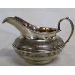Victorian silver jug with engraved decoration and inscription "Presented by the Earl of