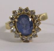 18ct gold, sapphire and diamond cluster ring - oval brilliant cut sapphire 1.7ct measuring approx.