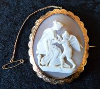 Large cameo brooch with classical depiction of a woman with an angel in a (tested as 15ct) gold