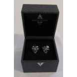 Boxed pair of silver designer Stephen Webster Dracula head cufflinks with red bead eyes, weight 20.5