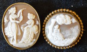 2 cameos with yellow metal mounts 2 ladies & a lady in a landscape largest 4.1cm by 3,4cm