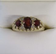 9ct gold 3 stone garnet and faux diamond chip ring  - total weight 3.3g - size Q