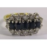 18ct gold ring with 5 baguette cut sapphires and 14 diamond surround - sapphire size approx 4mm -