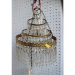 A gilt metal three-tier glass drop chandelier, 9" dia