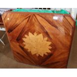 A walnut and marquetry games table with interchangeable tops for chess, cards, backgammon, etc, on
