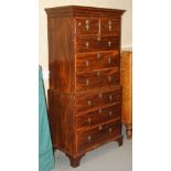 A walnut chest on chest of 18th century design, fitted two small and three long drawers over three