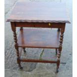 An oak two-tier tea-trolley, 23" wide x 18" deep x 30 1/2" high