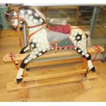 A mid 20th century carved and painted wood rocking horse, 46 1/2" long